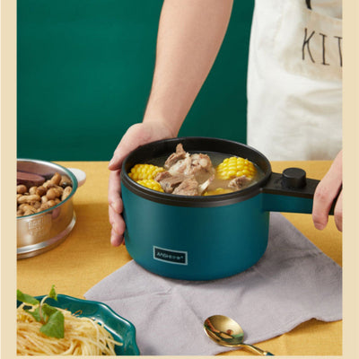 Nordic green small cooking pot on countertop with vegetables