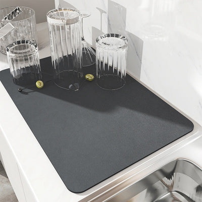 Modern black quick-dry dish mat with anti-slip rubber base on kitchen counter